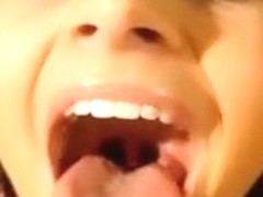 Beautiful brunette eats cum and shows her beautiful tongue