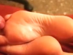 This nasty amateur cumshot video shows me jerking my wang over my hon's feet and cumming all over .