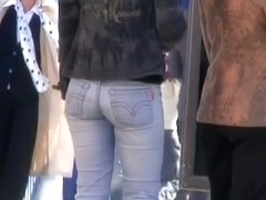 Modest looking blonde woman with cheeky ass in the street candid scene