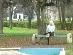 Spying Girl On Phone on Public Garden