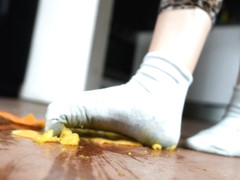 Wild Brunette In Socks Crashes An Orange With Her Feet