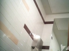 Blonde girl pissing in toilet on the hidden camera