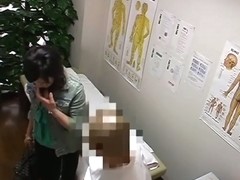 A plump Asian is showing her boobs and hairy pussy in the massage room