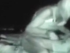 Voyeur tapes a partyslut riding a guy on a beach chair in public