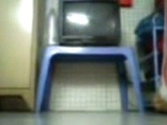 Asian girl plays with her hairy pussy and small tits closeup on the floor