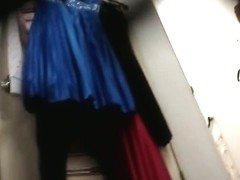 Voyeur dressing room video with female trying on new dress