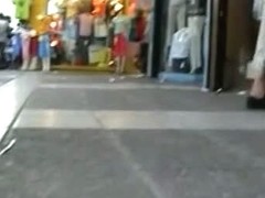 Gorgeous babes filmed upskirt by a voyeur guy