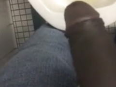 Taking a piss in the urinal at the library