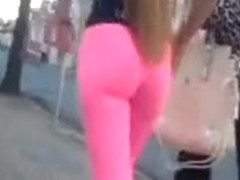 Hot pink spandex hugs her sexy ass and legs
