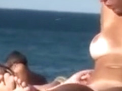 Lesbian girls sunbathe with their natural tits out