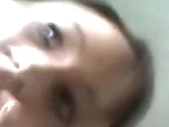 Pigtailed cutie masturbates her trimmed pussy with a vibrator on a chair