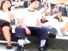 Asian girl unknowingly gets her hairy pussy taped upskirt in the park by a voyeur