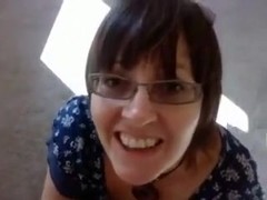Amateur brunette wearing glasses sucks a cock in POV clip