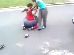 Black maids throwing punches in the street
