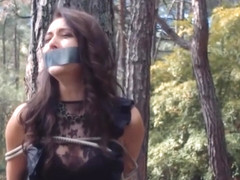 Russian Woman Tape Gagged And Tied To A Tree