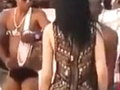 Hot Latina chicks dancing at a beach party