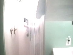 Sexy sporty girl gets caught in a shower by a hidden cam