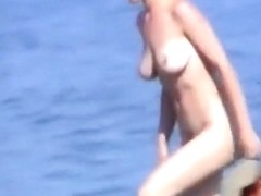 Voyeur tapes girls at a nude beach