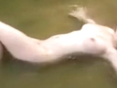 Outdoor clip with my GF bathing in a pond and showing her pussy