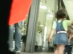 White milf w/ nice ass in a camo skirt gets filmed in upskirt video