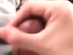 Young teen in bed jacking off hard