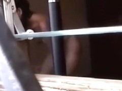 Voyeur tapes a hot latina girl getting dressed