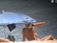 Voyeur webcam catches amateurs nude and half nude on beach