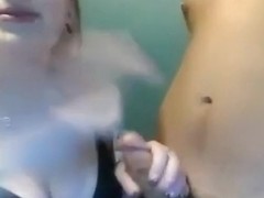 Redhead girl jerks her bf's cock, while his nerdy friend just gets to watch.