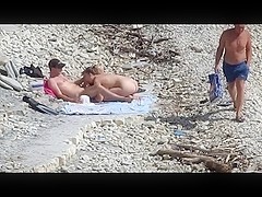 Couple fucked on a public beach while as people walked near