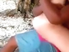 Brunette hussy jumps on my black schlong on a beach