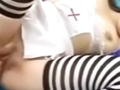Slender Japanese sweetheart lies in bed and gets her vagina fisted