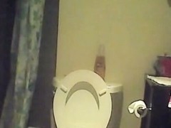 Hidden piss cam in the home toilet shows peeing sister