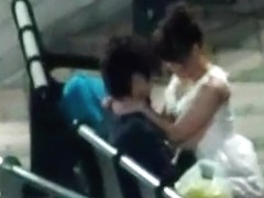 Voyeur tapes an asian girl couple having sex on a bench in the park