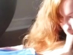 Natural redhead gives a blowjob after workout session