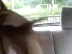 Mixed asian babe changing clothes in car