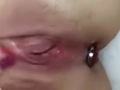 Plugged asshole and pussy close up