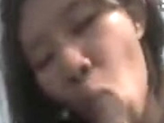 Asian lady looks so hungry sucking on cock