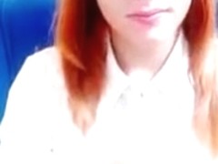 Red-haired beauty Alevtinia undressed in front of camera