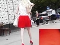 Blond in red gripping with sexy upskirt