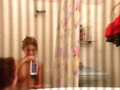 Guy tapes 2 girls naked in the bathroom