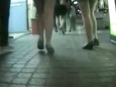 Hidden camera catching street candids of legs and butts
