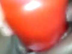 A red big sex-toy for the soaked and shaved brown cookie