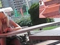 Sexy sitting upskirt in a street cafe