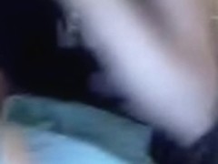 Woman masturbates with large toy.