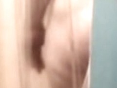 Fem butt and crotch reflected in the shower mirror spied