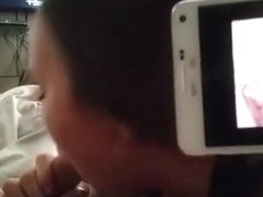 Watching porn on my cellphone, while my gf sucks me off.