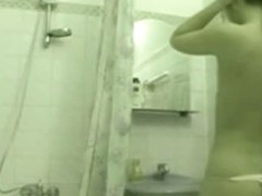 Sexy chick caught on a shower voyeur video