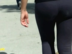 Juicy ass in black tights wiggling around candid camera