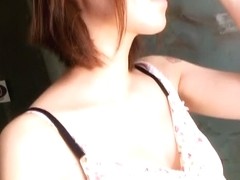 An amicable Asian lady with nice boobies front door downblouse video