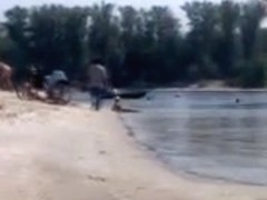 Hot teen blonde plays in the wet sand naked